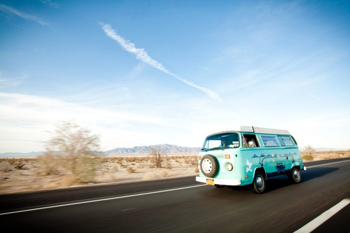 VW van driving down a desert highway