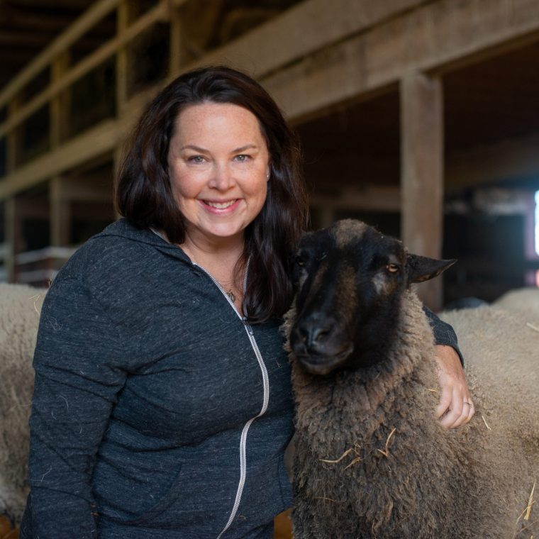 Megan Watkins, CEO of Farm Sanctuary with a sheep