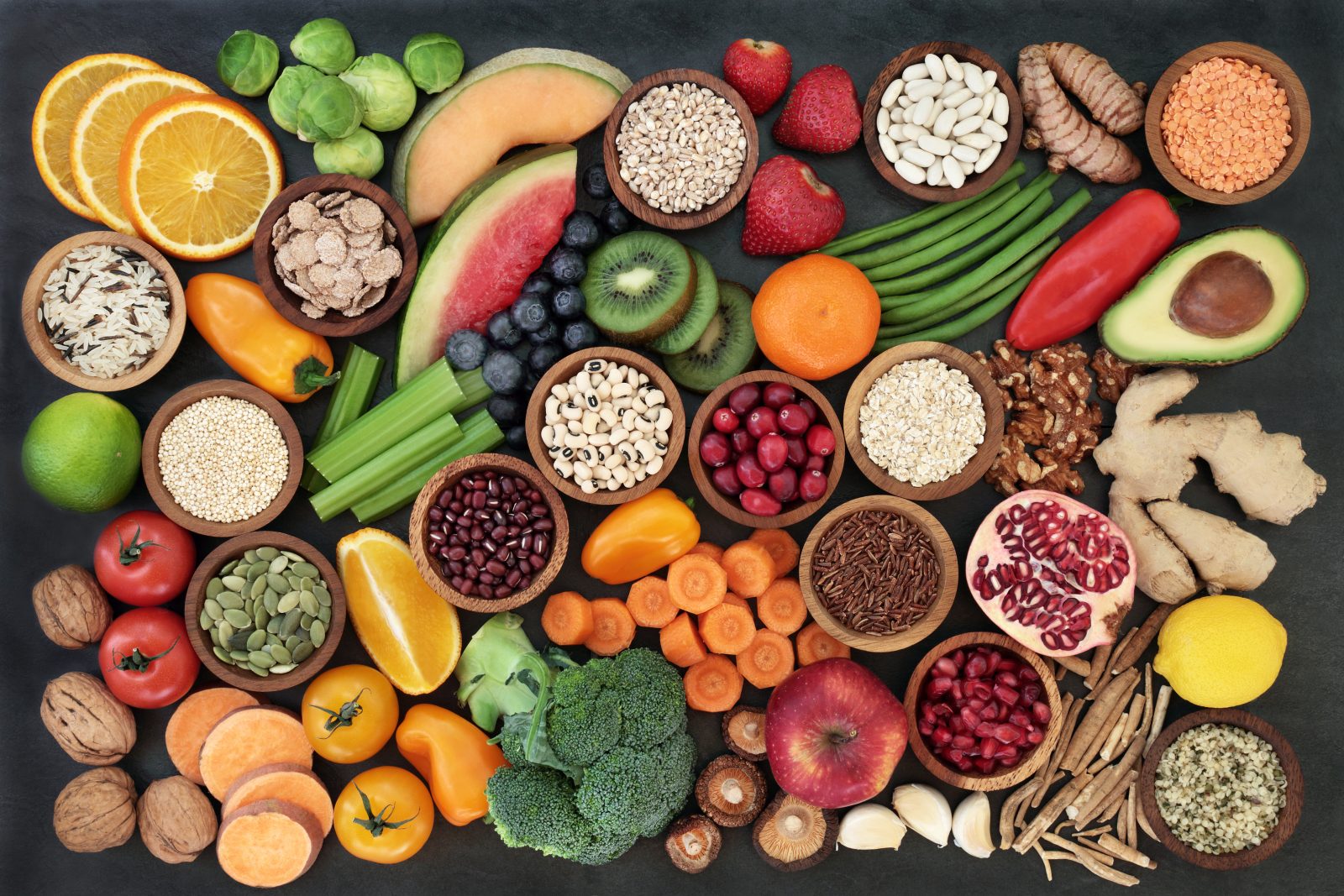 A spread of fruit, vegetables, seeds, pulses, grains, cereals, herbs & spices.